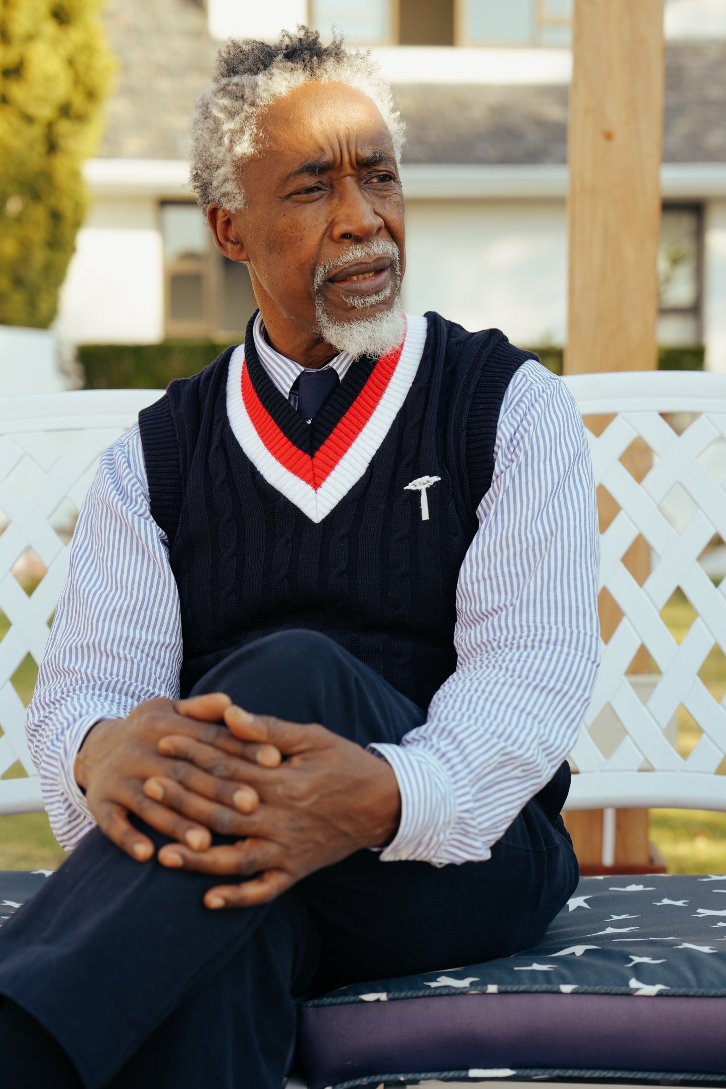 Navy blue cable-knit sweater vest.