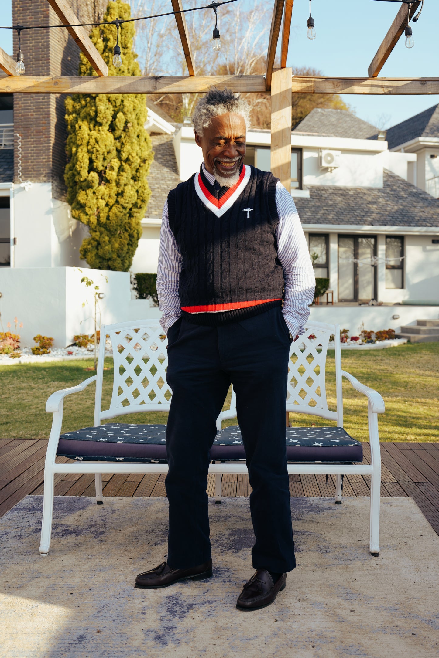 Navy blue cable-knit sweater vest.