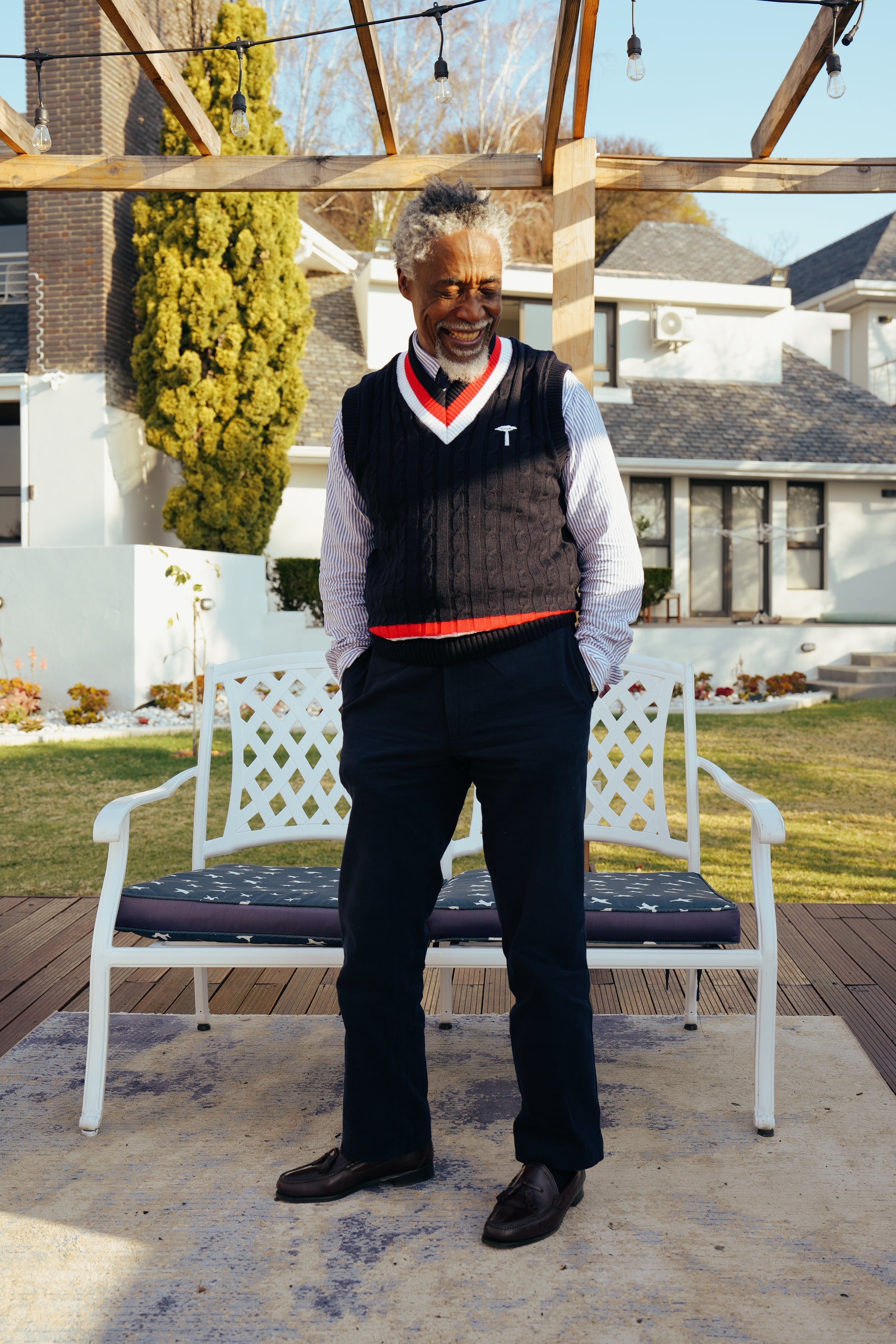 Navy blue cable-knit sweater vest.