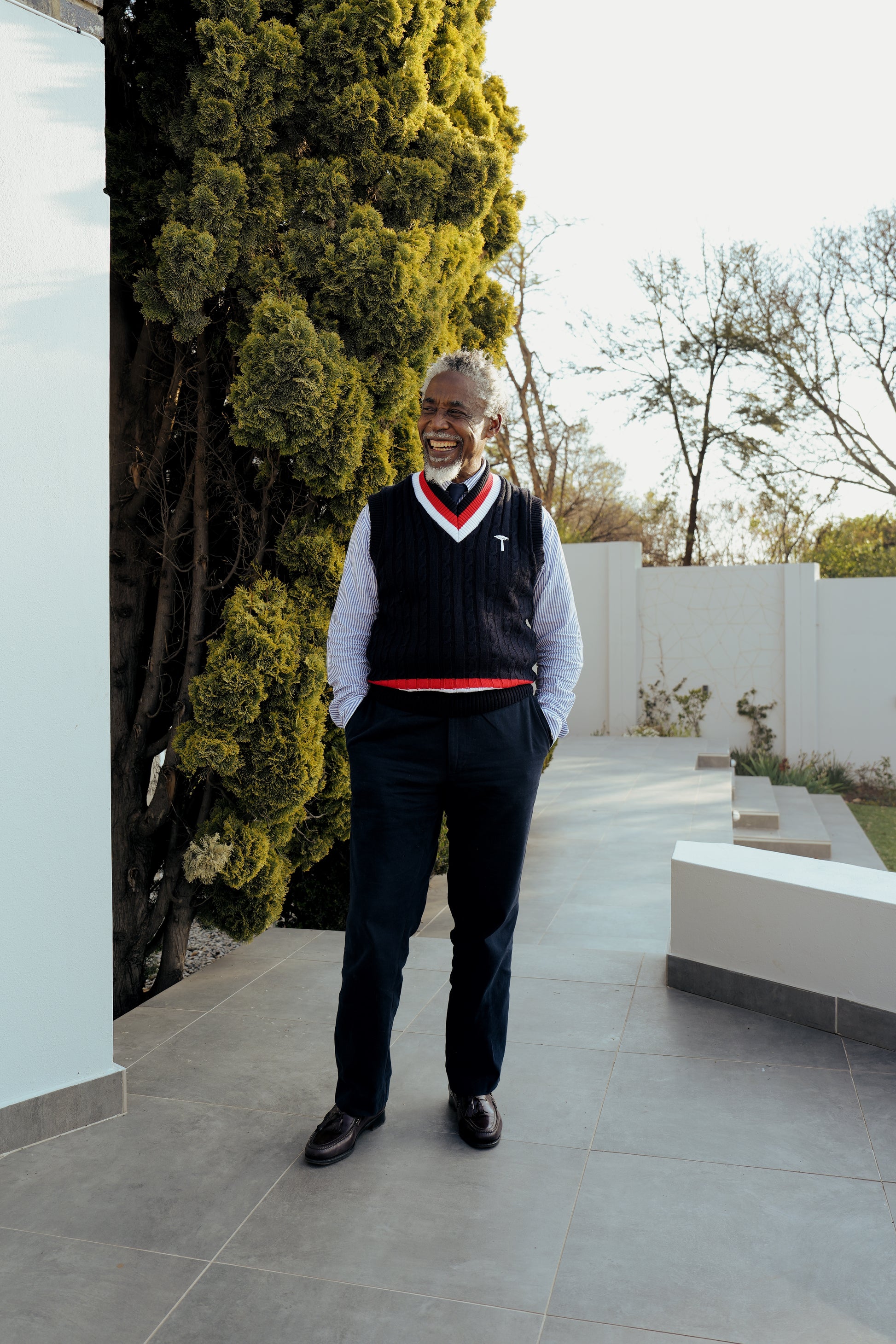 Navy blue cable-knit sweater vest.